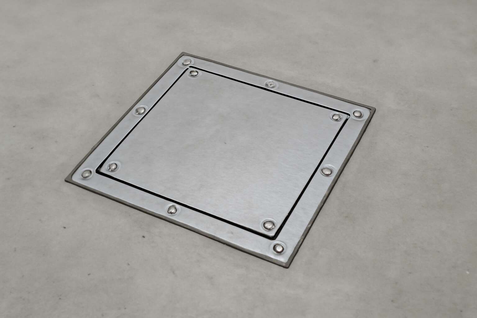 Reimagine Spaces with a concrete floor access panel that blends ...