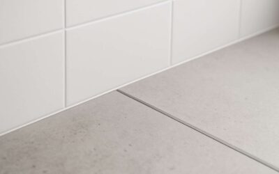 Master the wall tile to concrete floor transition with sleek, durable results.